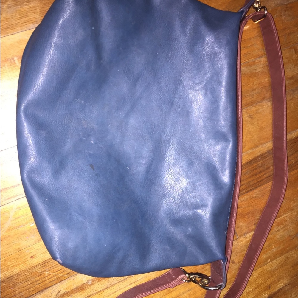 Blue purse with brown strap